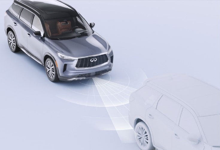 INFINITI QX60 demonstrating driver-assist safety features with radar projections on the road