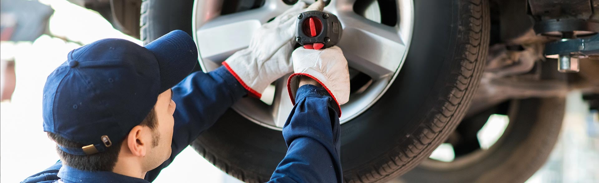 Service Technician working on car tire