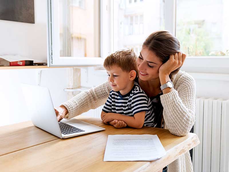 Family looking at a laptop
